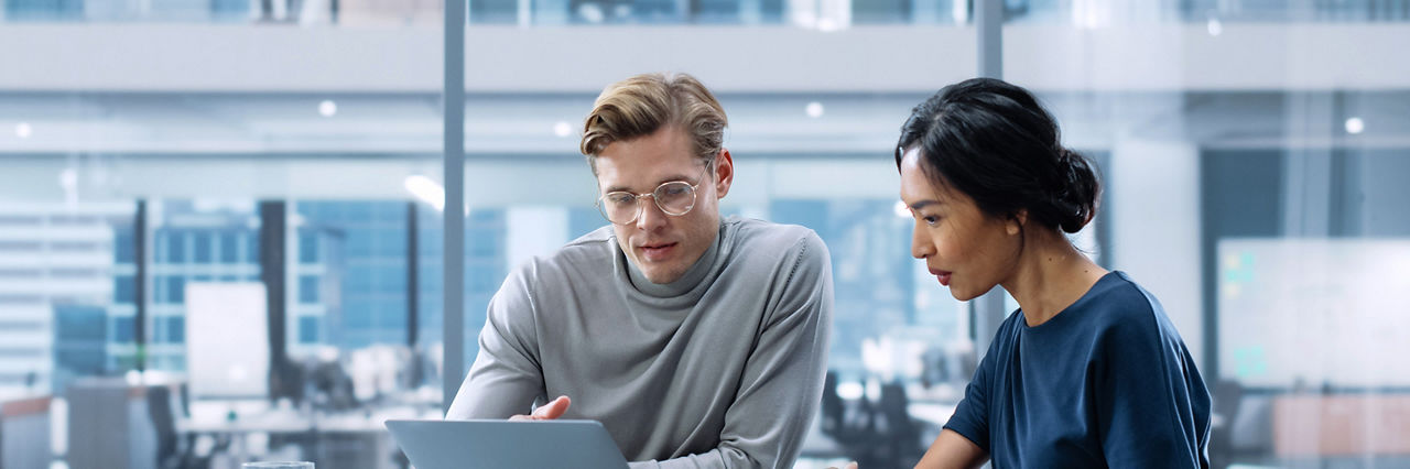 Multiethnic Diverse Office Conference Room Meeting: Team of Two Creative Entrepreneurs Talk, Discuss Growth Strategy. Stylish Young Businesspeople work on Investment and Marketing Projects.