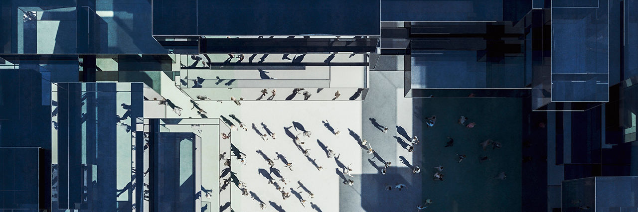 Modern glass office building with business people from above. 3D generated image.