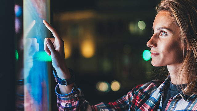 girl pointing finger to blank monitor display, hipster touch multimedia technology on light night city, click media lcd device, mockup screen information gadget