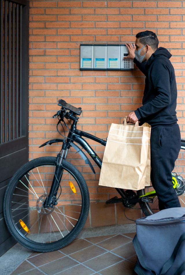 Stock Photo Of A Worker Delivering Food. 