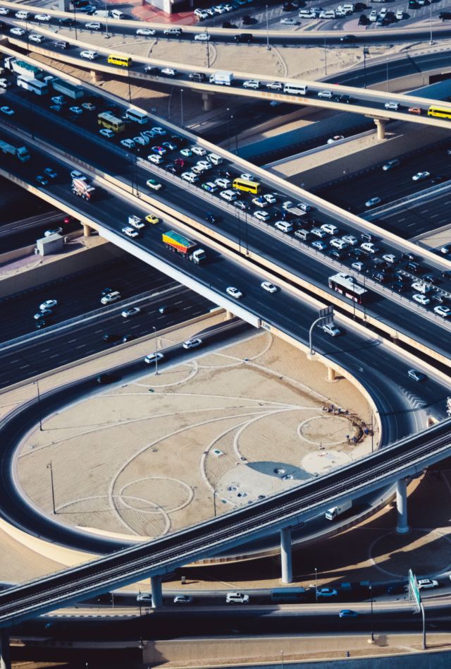 Aerial view of highway road intersections with traffic in Dubai