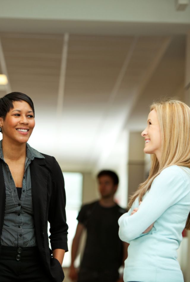 Extensive series of a large group of high school aged students in a modern school facility, with books, cell phones, backpacks, etc.  Also includes multi-ethnic teachers as well.