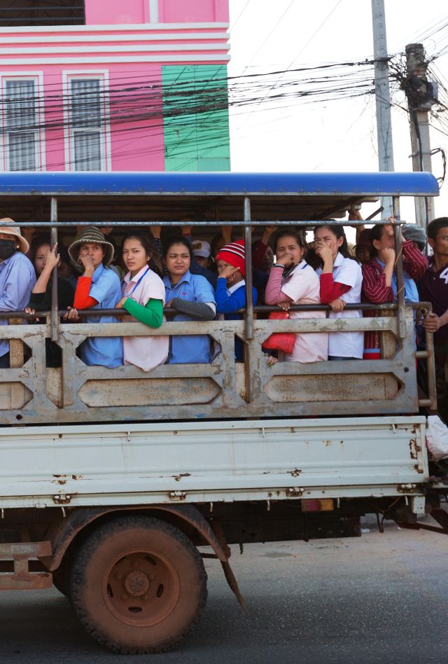 M68RBC Women workers from a local factory being transferred back to their village by lorry, Kampot, Cambodia Asia