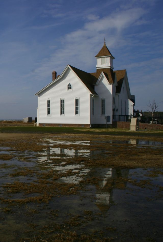 Church on Hooper island on the Chesapeake bay after a hard rain and near high tide