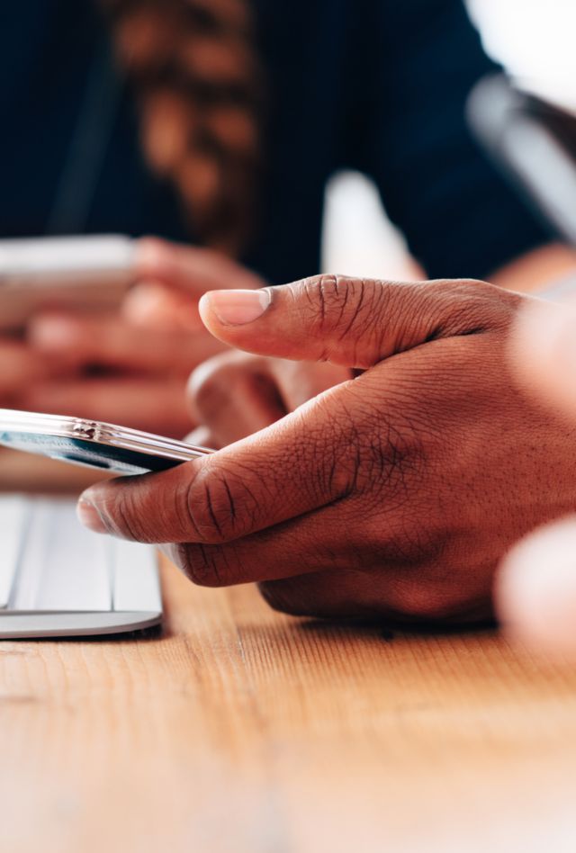 Group of people using smart phones to connect network with social media