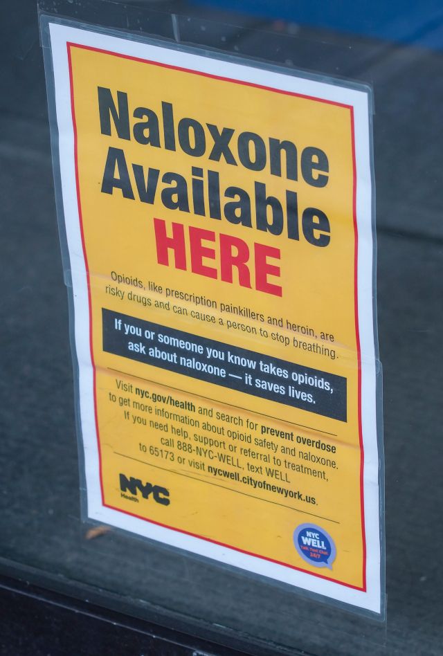 M9K8CT A sign on the door of a pharmacy in New York on Tuesday, March 20, 2018 informs customers that the store carries Naloxone, a drug used to treat opioid overdoses. President Donald Trump recently announced that as part of his plan to combat the country's opioid crisis he will try to get an expansion of the federal death penalty. (A© Richard B. Levine)