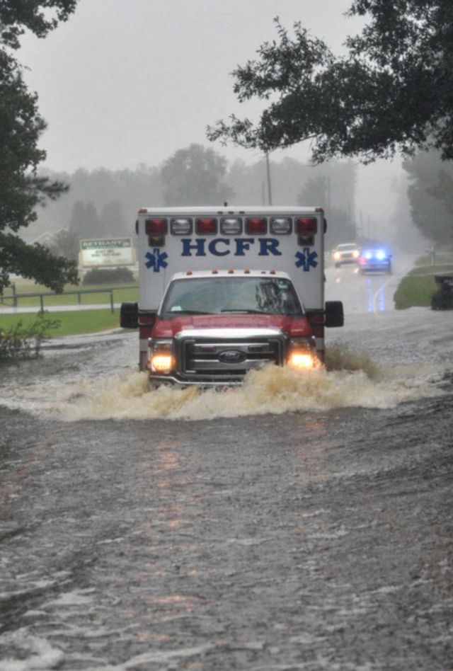 KHA8J7 Soldiers with the 1-178th Field Artillery Battalion, South Carolina Army National Guard (ACNG) help escort Horry County Fire Rescue paramedics through flooded roads to reach someone in need of medical attention in Conway, S.C., during Hurricane Matthew, Friday, Oct. 8, 2016. SCNG Soldiers and Airmen were activated Oct. 4, 2016 in support of state and county emergency management agencies and local first responders with coastal evacuations and any services or resources needed to assist the citizens of South Carolina after Governor Nikki Haley declared a State of Emergency. U.S. Air National Guar