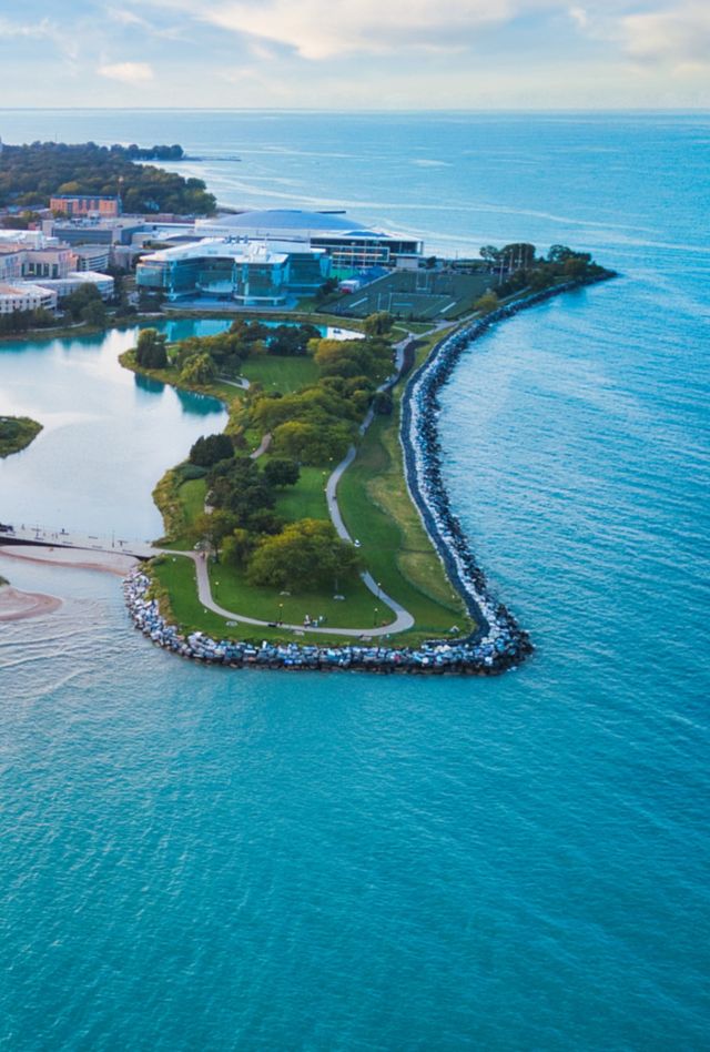 An overhead view of a group of buildings along a coastline