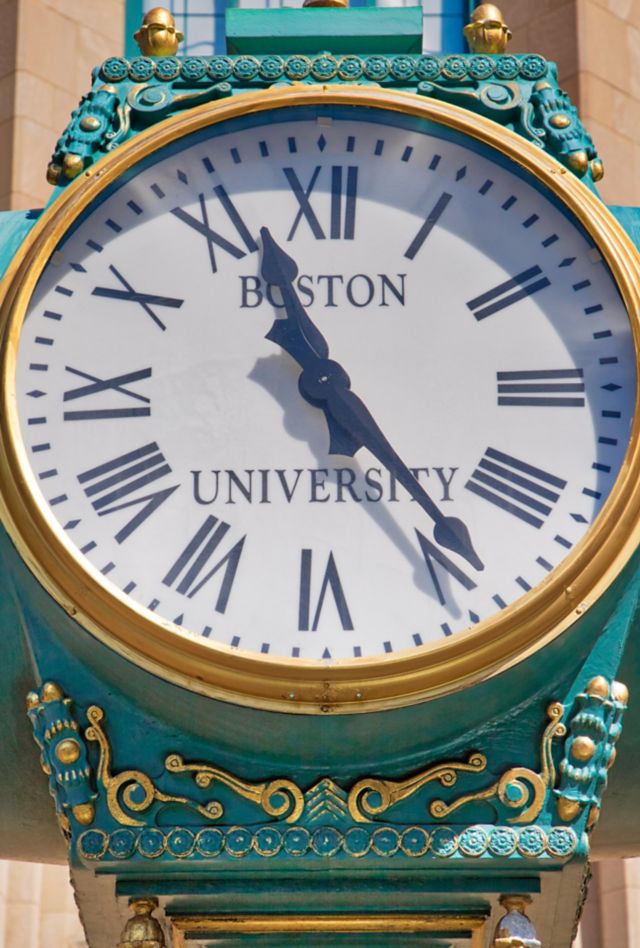 A brightly colored clock which reads "Boston University" on the face