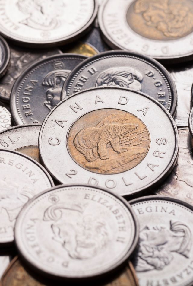 "Calgary, Canada - February 26, 2013: A studio shot of a pile of current, modern day, legal tender Canadian coins."