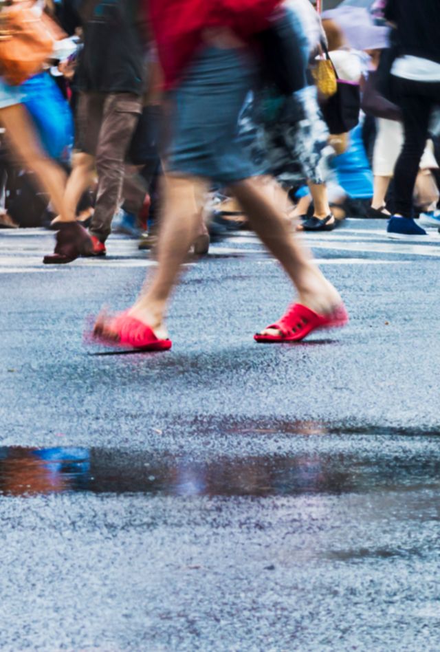 People, crossing Shibuya Scramble Intersection, Tokyo, Japan on a rainy day. 