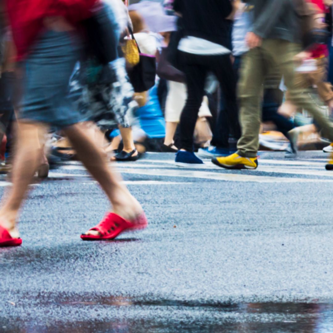 People, crossing Shibuya Scramble Intersection, Tokyo, Japan on a rainy day. 