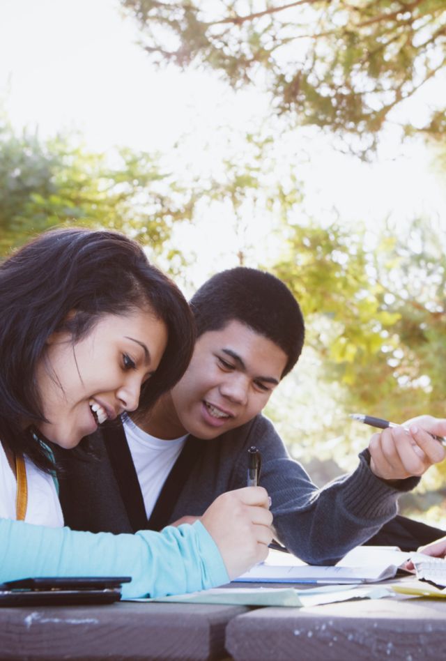 New Americans - Minority High School Students Working Together Outdoor after School