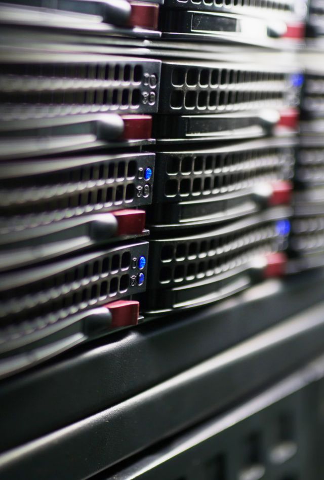 Rack of super computer technology in a data center cluster. Closeup of modular data center technology component. Server rack processing data