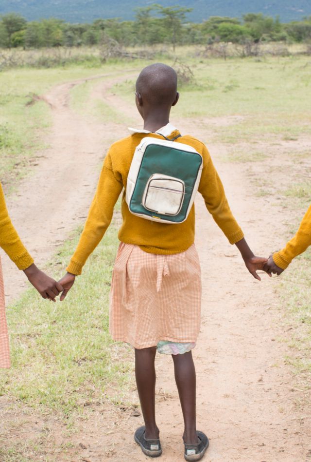 School children holding hands