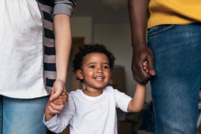 Happy family having fun in home. Multiethnic family concept.