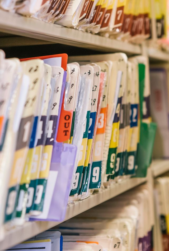 Medical Records on shelf in Doctors office
