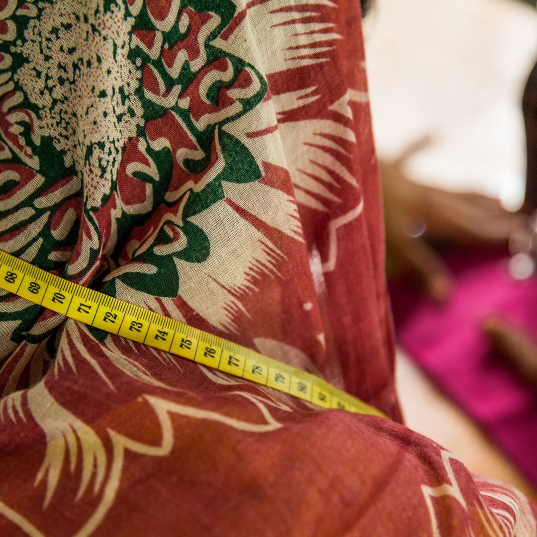 A Bangladeshi woman practices sewing.