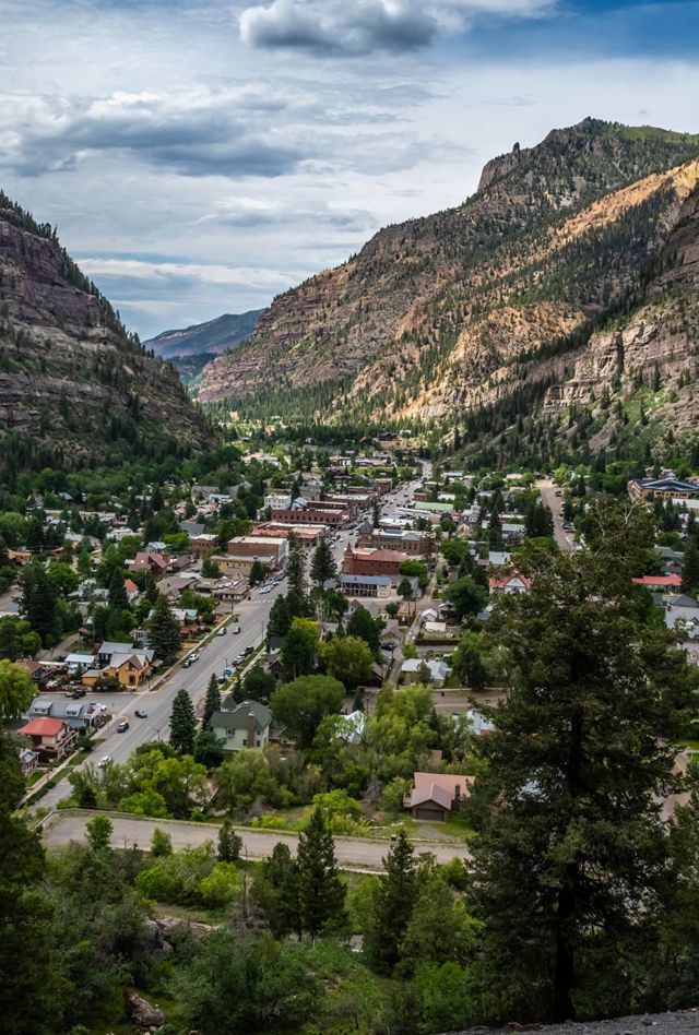 A breathtaking overlook showing lush trees and rugged walls
