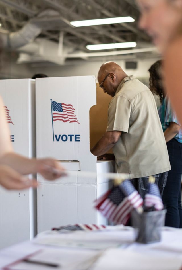 People voting at the local community center