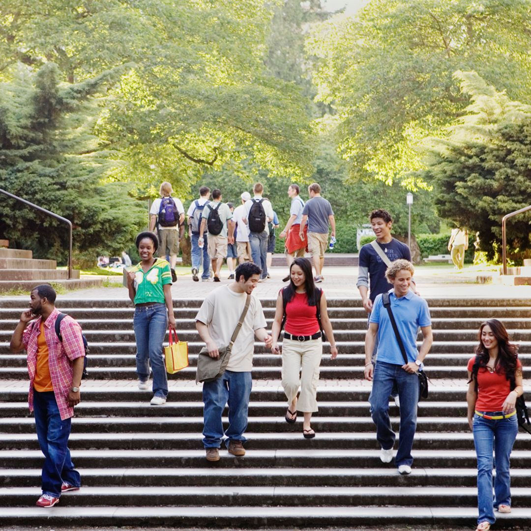 Students walking down the steps of a university building