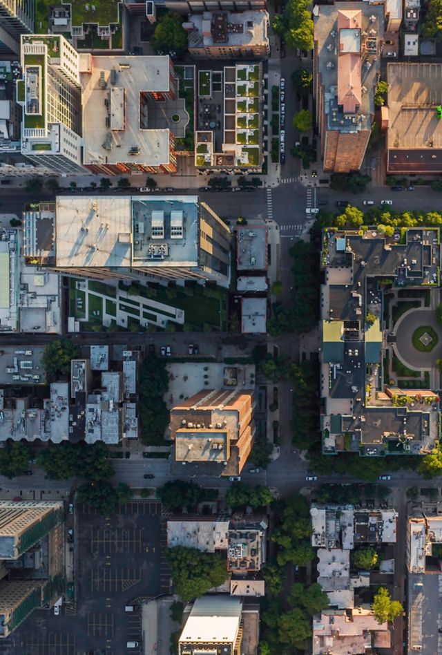 Top down aerial view of Chicago Downtown urban grid with park. Late afternoon light