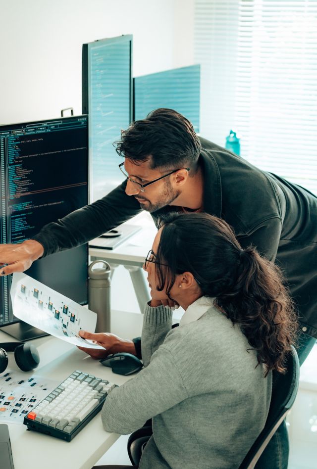 Hispanic Programmers Collaborating on Software Development in a Modern Office Setting