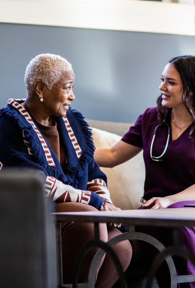 Nurse doing in home consultation with senior woman