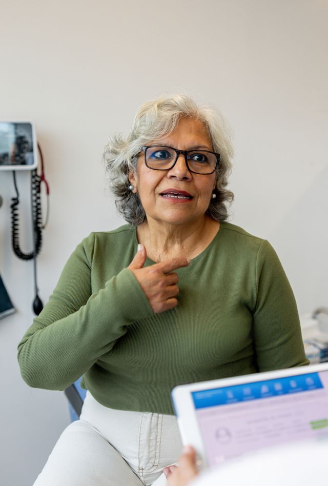 An older woman with a health care worker during an appointment