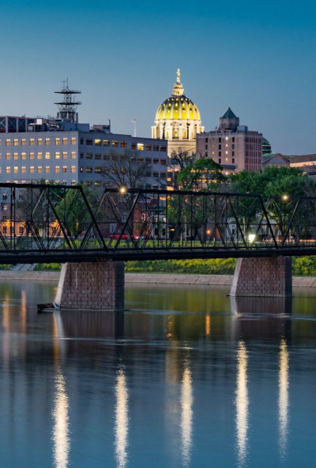 Harrisburg, Pennsylvania night skyline from the Market Street bridge with state capitol dome in the background.