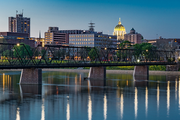 Harrisburg, Pennsylvania night skyline from the Market Street bridge with state capitol dome in the background.