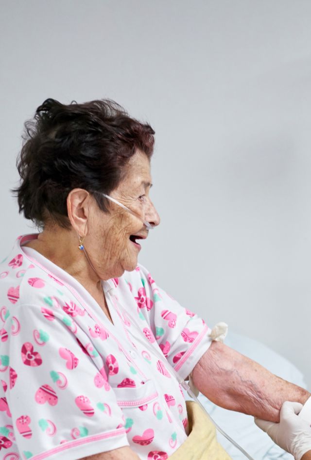 An older woman with a health care worker during an appointment