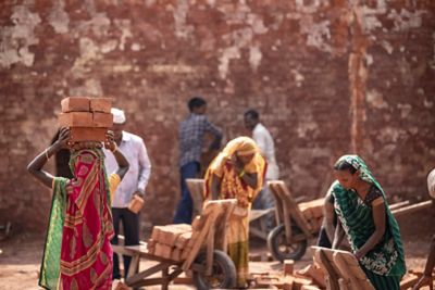 Group of laborers working in a brick factory
