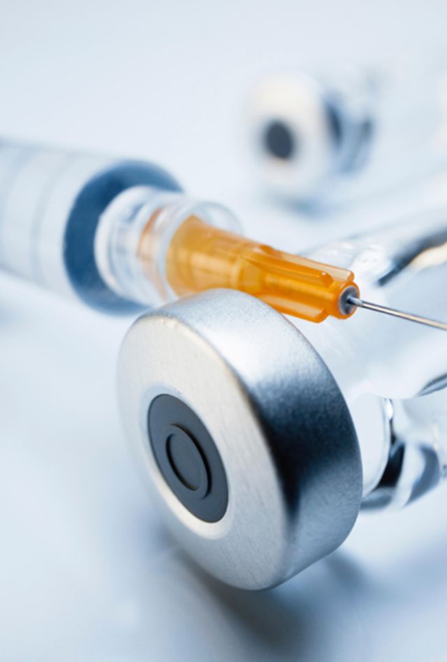 HBATNA Injectable medications in sealed vials and a disposable plastic medical syringe