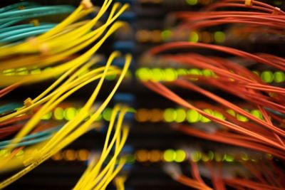Multi-colored cables connected to a server. Photographer: Andrey Rudkov/Bloomberg