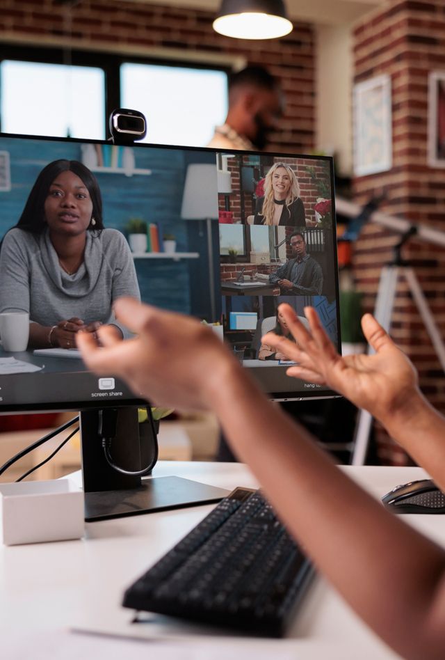 woman taking a video call from home living room.