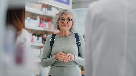 Person using AI chatbot virtual assistance app on smartphone