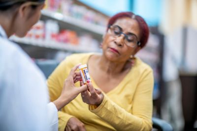 Medical professionals and pharmacists provide medication at the pharmacy.