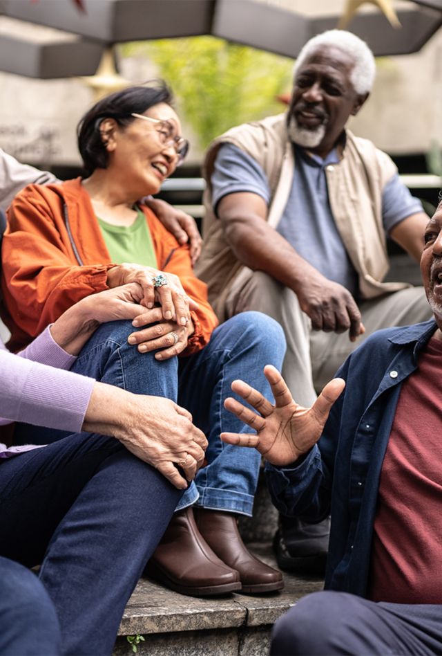 Senior friends talking outdoors