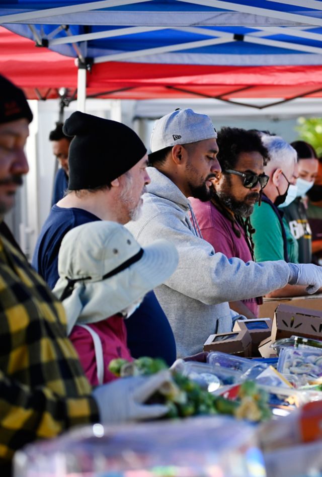 Community members distributing food and supplies