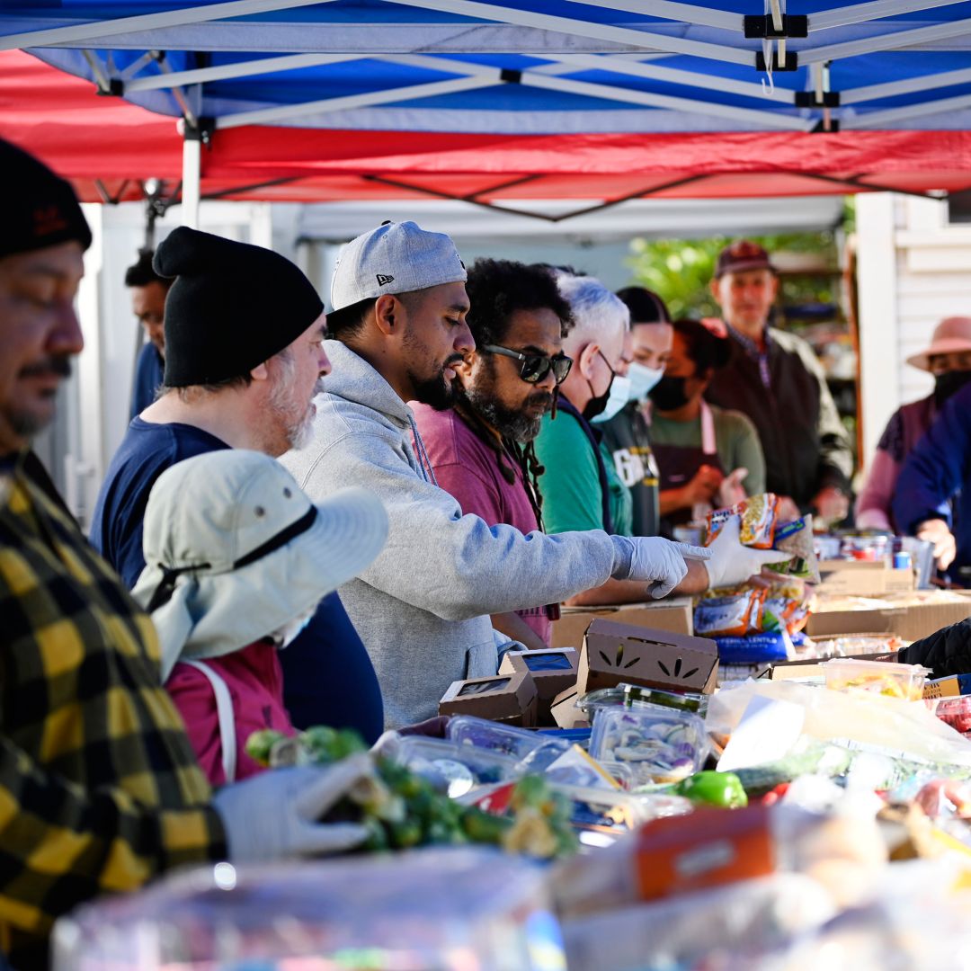Community members distributing food and supplies