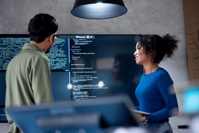 Involve People in Decisions to Improve Performance, Efficiency, and Productivity in Software Development. Diversity of team software developer on a software project discussion to define project timeline in a tech business office.