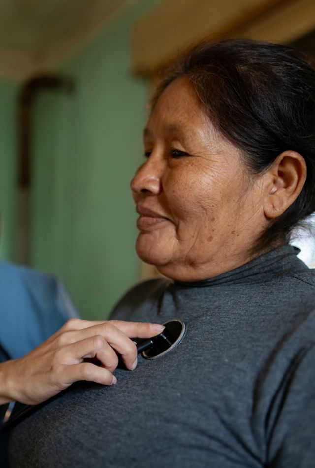 Latin American woman getting a medical exam at home