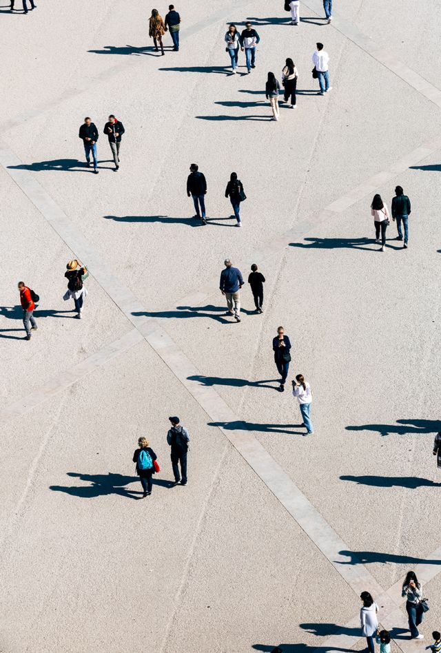 aerial image of clusters of people scattered across different points in a grid
