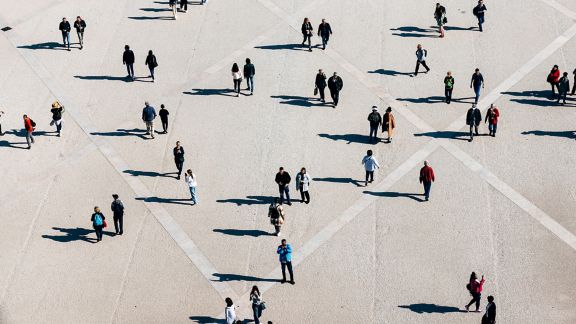 aerial image of clusters of people scattered across different points in a grid