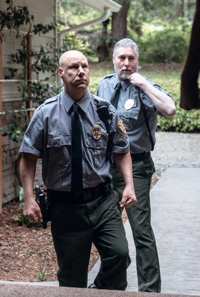 Two police officers at someone's front door