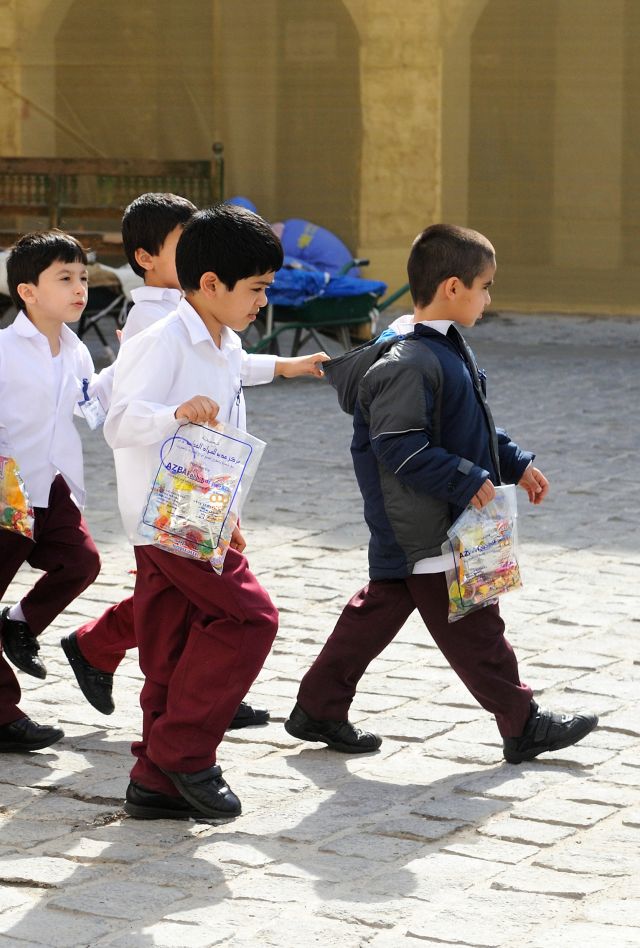 School children wearing school uniforms in Qatar