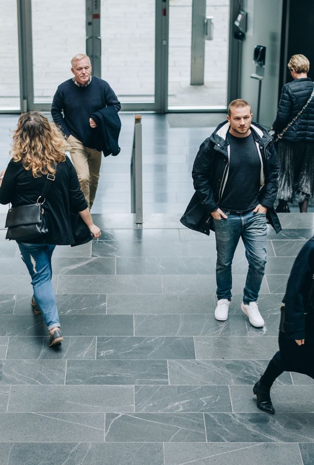 High angle view of business people in a lobby. Business people walking through a office hallway.