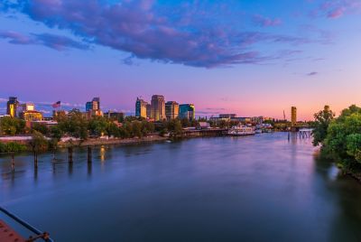 Skyline of Sacramento, California, USA at Dusk with Sacramento river and Tower Bridge.