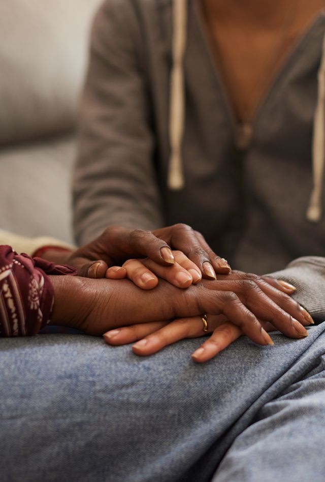 image of two people hand in hand.